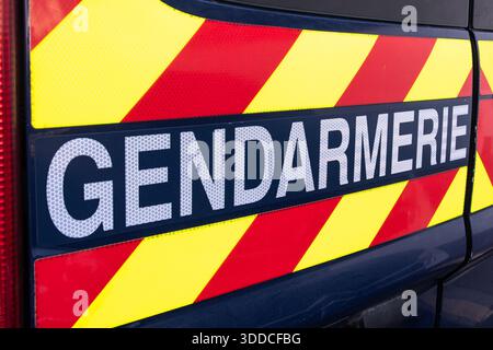 Close-up of a "Gendarmerie" sign written in French on the side of a patrol and intervention vehicle of the French National Gendarmerie, Paris, France Stock Photo