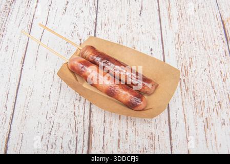 Chinese-style grilled sausages served as lollipops Stock Photo