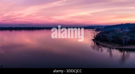 Kerkini, Northern Greece — Soft sunrise colors reflect on the still lake, capturing pure beauty, calmness, and natural harmony. Stock Photo