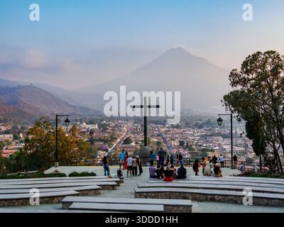 Cross at Cerro de La Cruz, city and Agua Volcano in the background, Antigua Guatemala, Sacatepequez Department, Guatemala Stock Photo