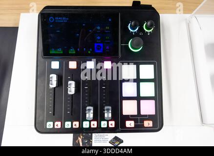 Professional podcast audio mixer with touchscreen interface, illuminated buttons and sliders, modern sound recording console for streaming, broadcasti Stock Photo