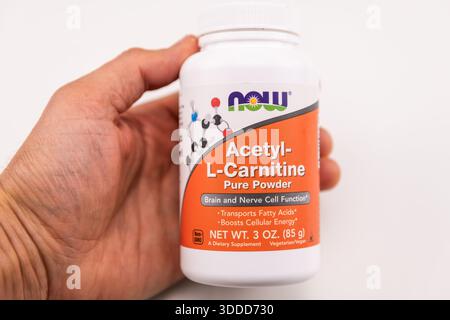 Naples, USA - May 4, 2022: L-carnitine powder by Now Foods bottle of dietary supplement for burning fat against white background macro closeup in Stock Photo