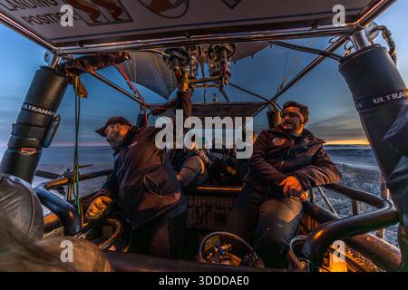 Passengers enjoy a balloon ride at sunrise in Göreme, Central Anatolia Region, Turkey Stock Photo