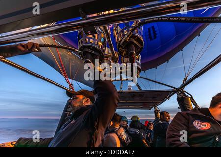 Passengers enjoy a balloon ride at sunrise in Göreme, Central Anatolia Region, Turkey Stock Photo