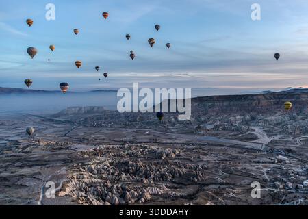 Hot air balloons float above the unique landscape of Göreme, Central Anatolia Region, Turkey Stock Photo