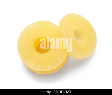 Canned pineapple rings on white background Stock Photo