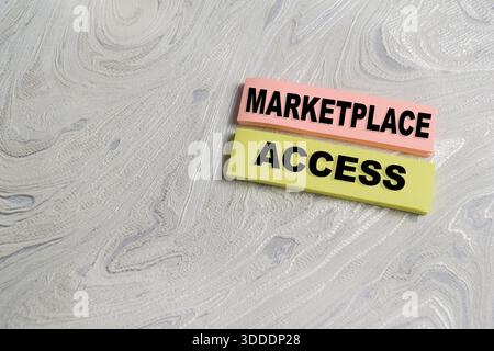 Concept of marketplace access write on sticky notes isolated on Wooden Table. Stock Photo