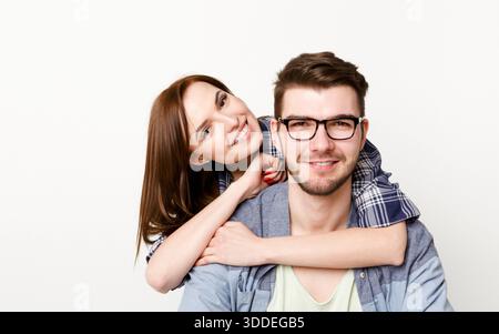 Happy casual couple posing to camera, isolated Stock Photo