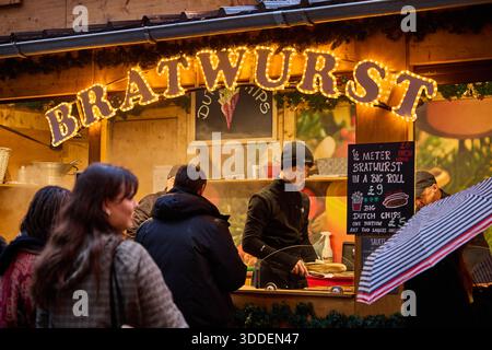 Christmas Markets in Manchester City centre St Annes Square selling Bratwurst Stock Photo