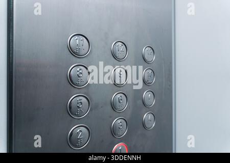 Elevator buttons for floor selection, silver buttons of a large elevator, from the 1st floor to the 13th floor buttons. High quality Stock Photo