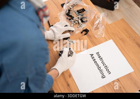 Metal hinges and furniture fittings for DIY assembly at home. top view. Stock Photo