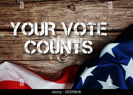 Your Vote Counts text message with USA flag on wooden background Stock Photo