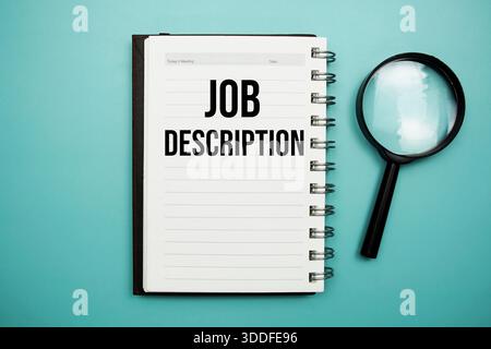 Job Description text written on notepad with alarm clock Stock Photo