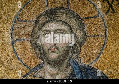 Deesis mosaic (detail) of Christ Pantocrator, a late 13th‑century Byzantine gold‑ground mosaic completed around 1261–1300 and located in the upper south gallery of Hagia Sophia, Istanbul, Turkey. Stock Photo