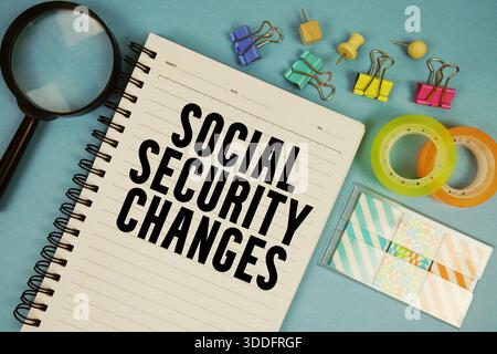 Social Security Changes text with magnifying glass on blue background Stock Photo