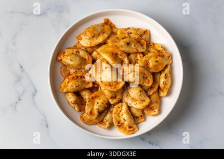 Potato-filled hingel dumplings are delicious. Stock Photo