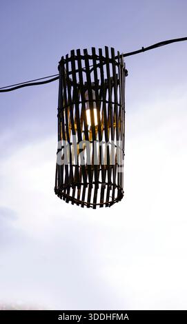 Wooden style outdoor light shade in purple sky background Stock Photo