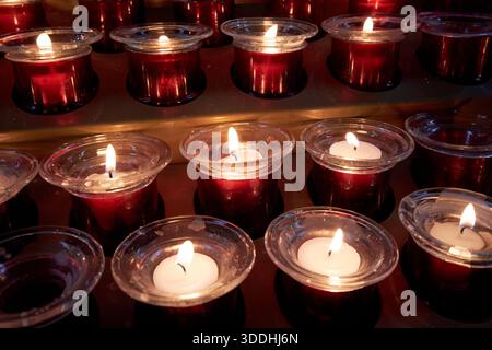 offetory candles burning in catholic church gdansk poland Stock Photo