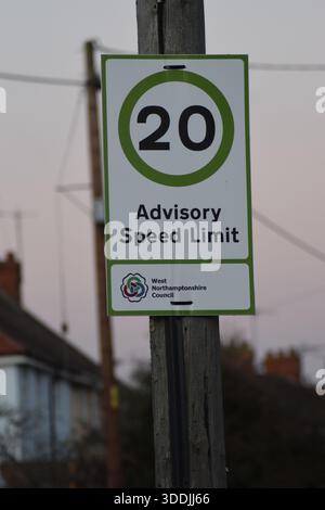 Road sign showing a 20 mph speed limit in a residential area on a white ...