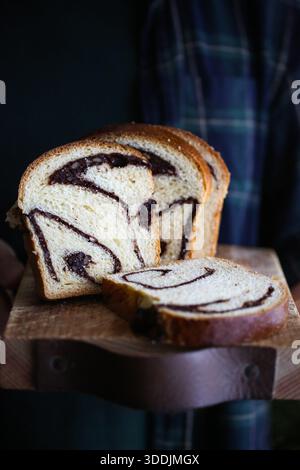 Homemade Romanian cozonac with walnuts and chocolate filling Stock Photo