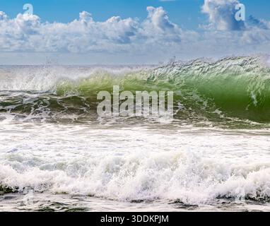 detail of a crashing wave on a montauk beach on a summer day Stock Photo