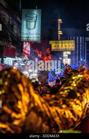 Bangkok, Thailand – January 30 2025: Traditional Chinese dragon dance performed during Lunar New Year celebrations in Yaowarat, Bangkok’s Chinatown. Stock Photo