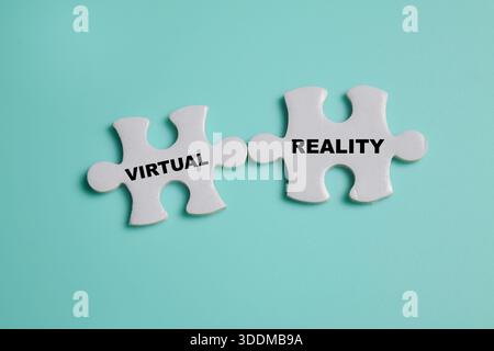 Piece of jigsaw puzzle with word virtual and reality. Business and finance concept Stock Photo