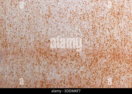 A close-up front view of a weathered rusty metal surface showing orange-brown patina and rough texture. Great for industrial, construction, and design Stock Photo