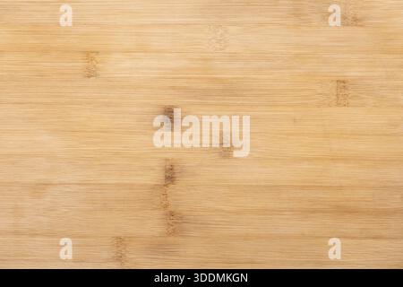 Close up photo texture of a bamboo cutting board, natural wood texture in beige yellow tones, front view Stock Photo