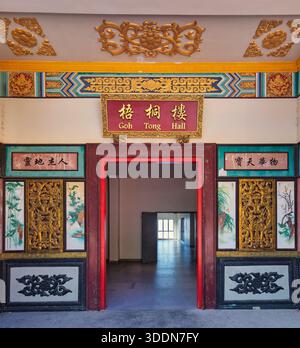 Entrance of Goh Tong Hall, Chin Swee Caves Temple complex, Genting Highlands, Malaysia. Ornate traditional Chinese architecture with vibrant red and gold details. Stock Photo