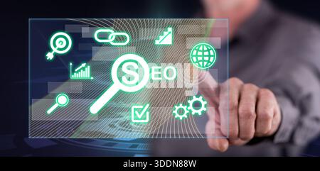 Man touching a seo concept on a touch screen with his finger Stock Photo