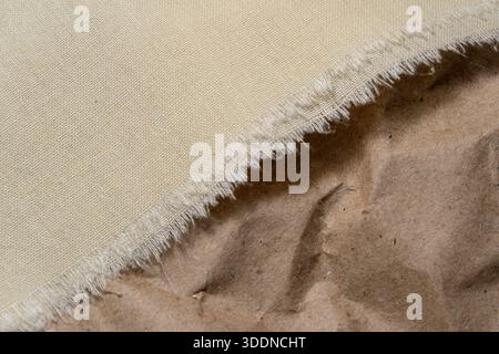 Canvas textures blend with rustic paper in a creative display of materials. Stock Photo