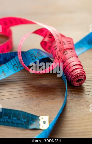Close-up of numbers and markings on a yellow flexible tailor tape measure Stock Photo
