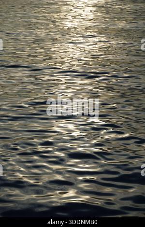 Sea water abstract background of waves on the sea surface in the vertical position Stock Photo