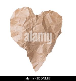 Heart shape made of crumpled brown kraft paper, isolated texture for handmade, eco, and rustic love concepts. Stock Photo