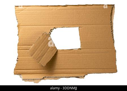 Rough torn cardboard frame with irregular cut hole, isolated on white for creative borders, posters, and collage layouts. Stock Photo