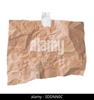 Rectangular crumpled kraft paper taped on white background, vintage note or announcement concept. Stock Photo