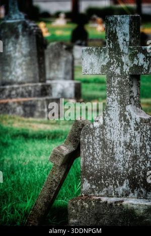 Broken gravestone in an old cemetery Stock Photo