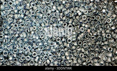 Mass production of metal fasteners as industrial manufacturing concept. High quality photo Stock Photo
