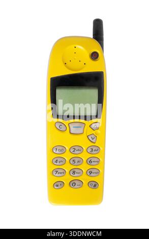 Old yellow mobile phone isolated on white background, vintage cell phone Stock Photo