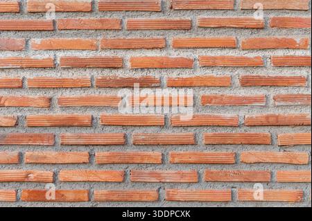Red brick wall texture forming classic architectural background Stock Photo