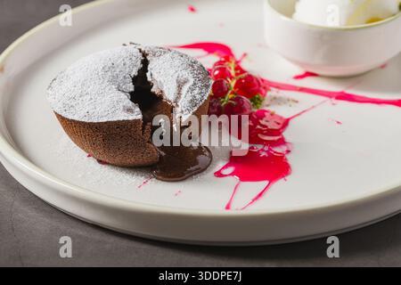 Warm chocolate lava cake with flowing center and powdered sugar Stock Photo