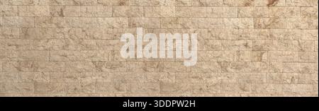 Beige rough stone wall texture creating a natural tiled masonry background Stock Photo