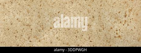 Beige granite stone surface showing natural textured pattern ideal for backgrounds Stock Photo