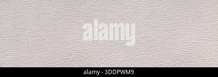Rough gray plaster creating an uneven texture on a full frame wall surface Stock Photo