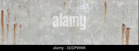 Weathered grey concrete wall showing corrosion stains and a rough texture Stock Photo