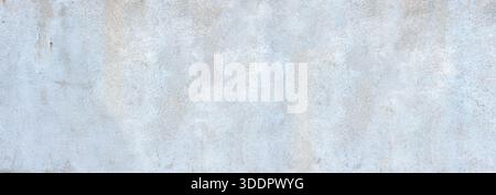 Grey concrete wall creating a textured grunge background Stock Photo