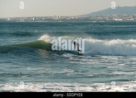 surfer on the wave in portugal Stock Photo
