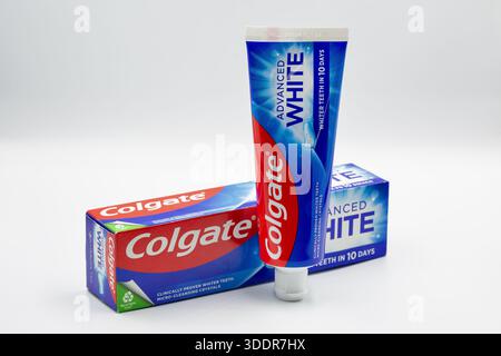 Kyiv, Ukraine - December 1, 2024: Colgate fluoride Advanced White toothpaste pack ant tube closeup on white. Colgate is a manufacturer of a wide range Stock Photo