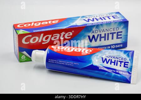 Kyiv, Ukraine - December 1, 2024: Colgate fluoride Advanced White toothpaste pack ant tube closeup on white. Colgate is a manufacturer of a wide range Stock Photo